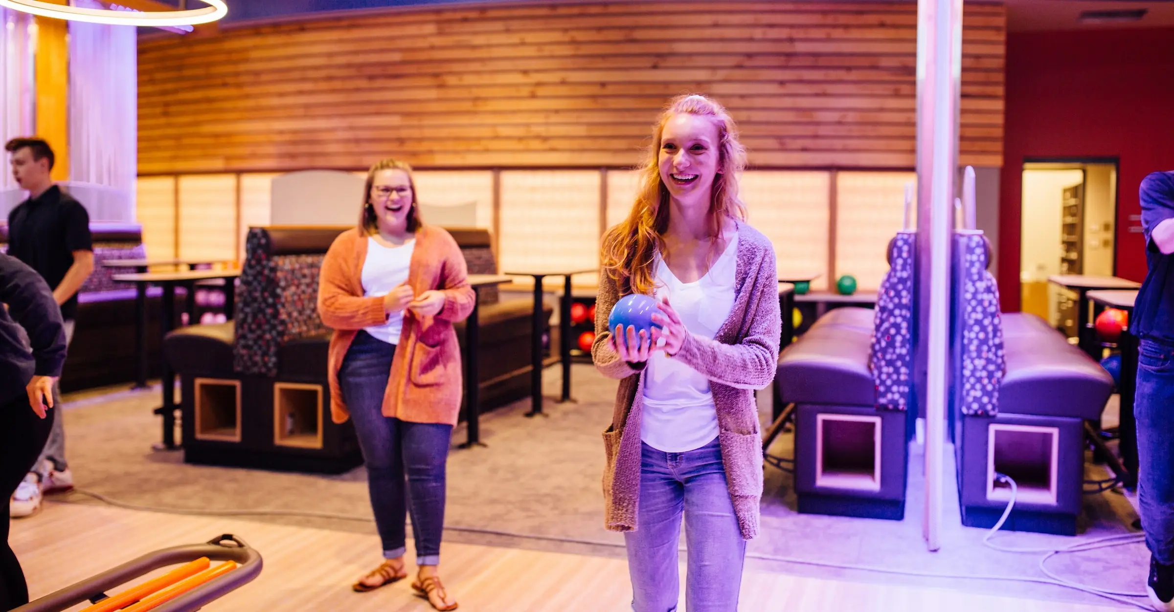 Two women bowling at Ocean5