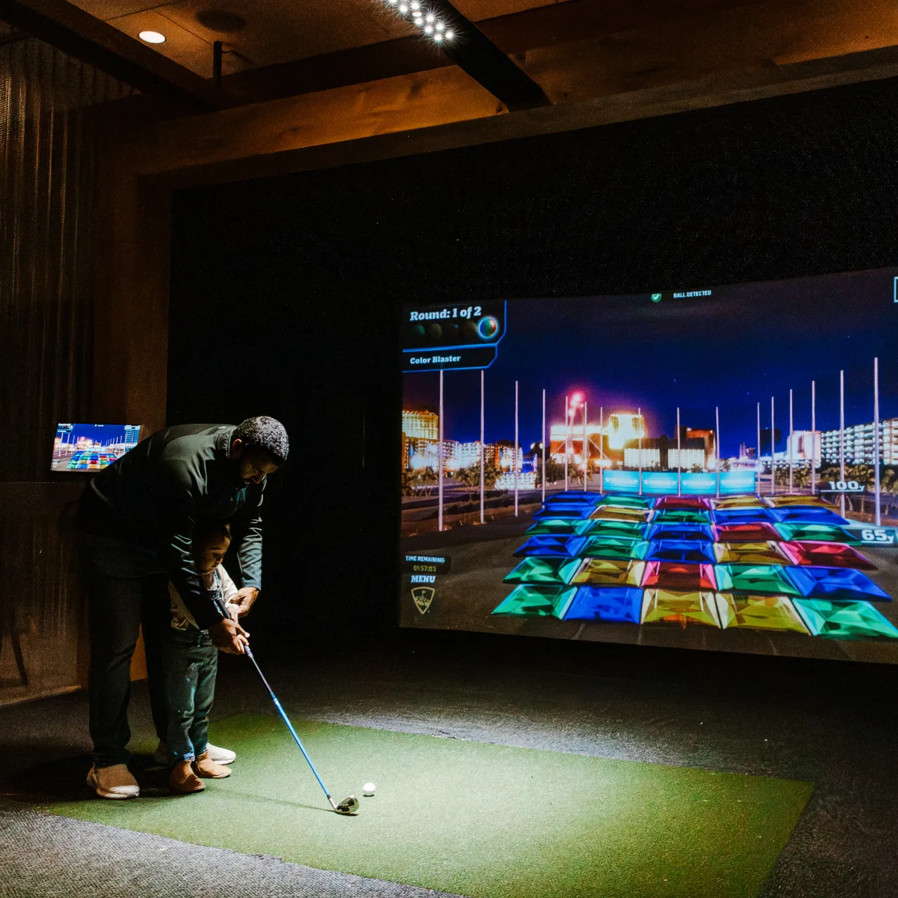 Man playing golf at Topgolf swing suite at Ocean5